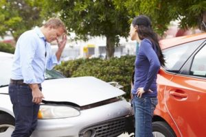  two drivers arguing after traffic accident